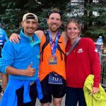 Adam Ironman Finish - Image of three athletes finishing a race